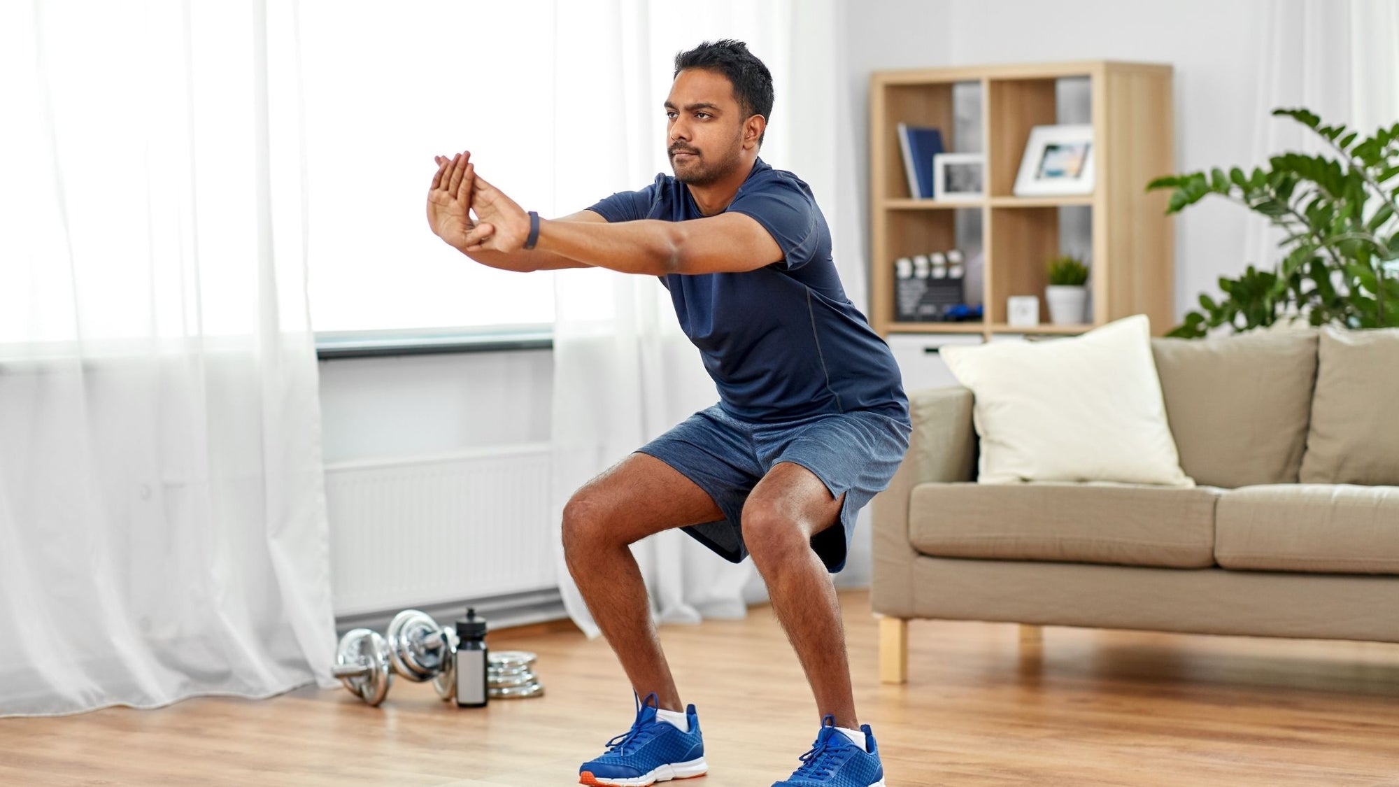 Man doing his bodyweight exercise routine at home